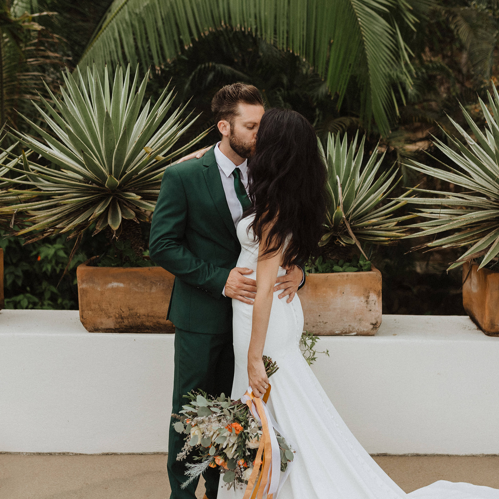 Bride and groom share a kiss during their elopement shoot in Mexico with Alexa Ann Photography