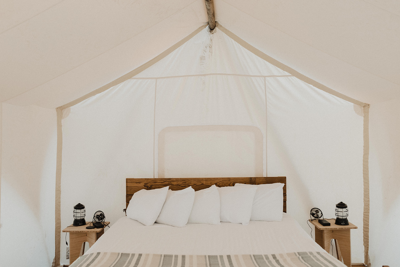Destination Elopement Guide: Interior view of tent with bed in it