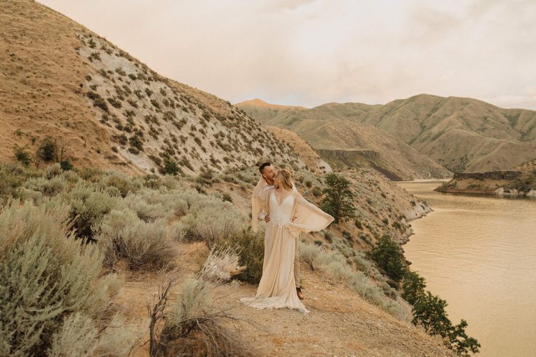 Couple poses for a photo in the desert in Wyoming, a top elopement destination in the Pacific Northwest, taken by Alexa Ann Photography