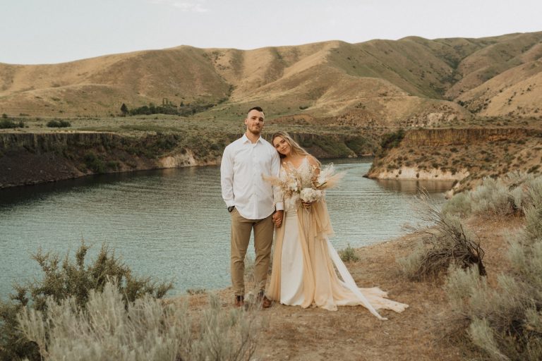 Couple posing in front of the lake at City of Rocks, one of the best places to elope in Idaho